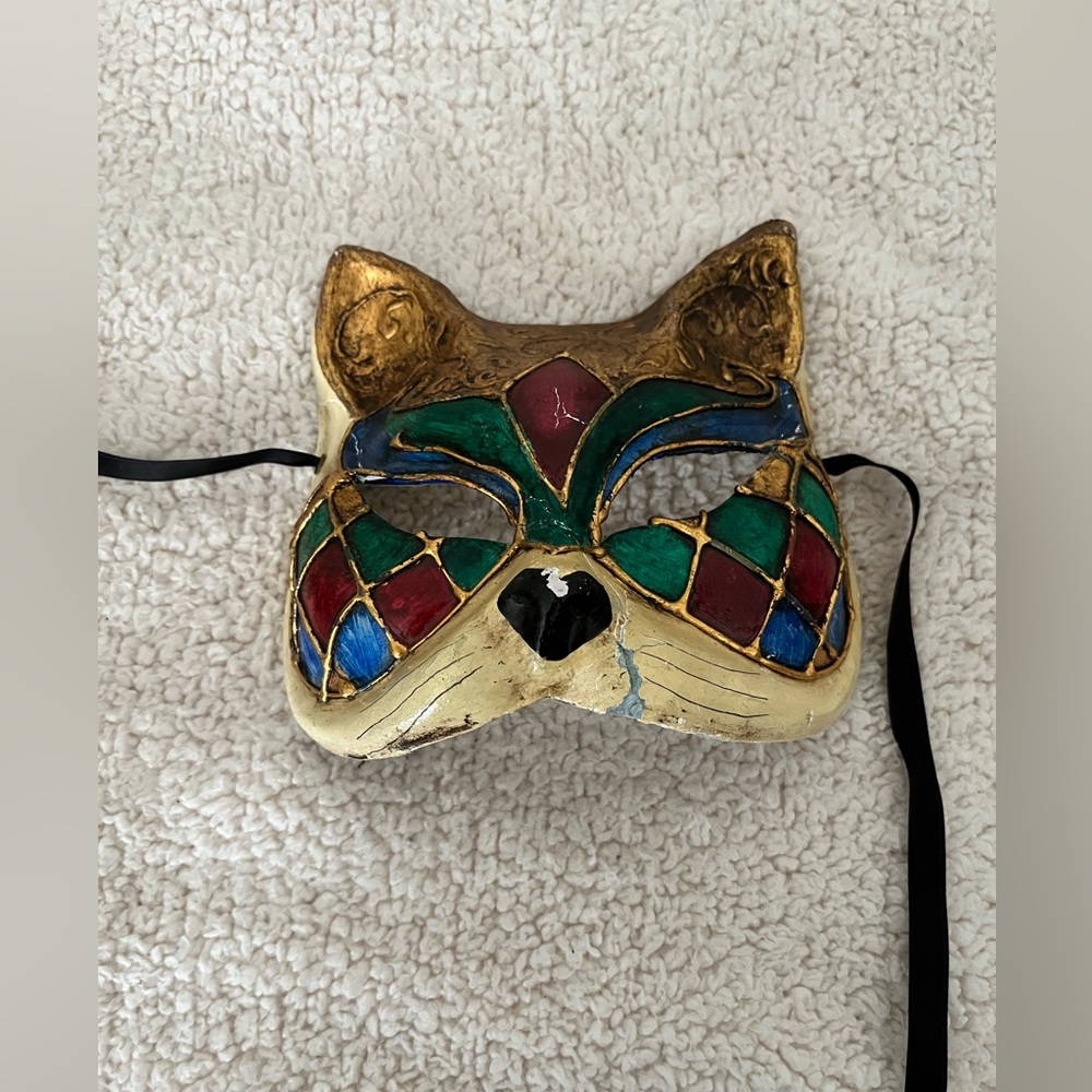 Harlequin Venetian cat mask ribbons. Halloween masquerade costume eyes wide shut